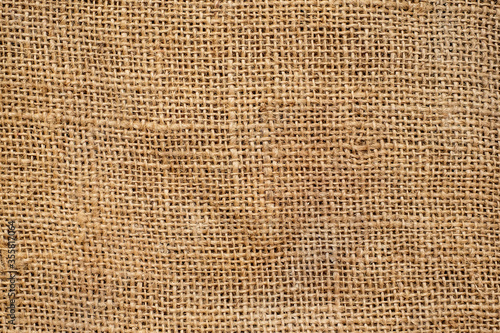 Brown sackcloth texture. or Background of Natural Brown Fabric Sack weaving is a bag. For packing