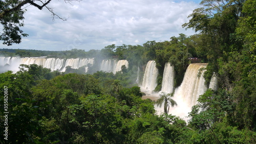 Views of the spectacular Iguazu waterfall on a sunny day i from many points of view