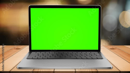 Wallpaper Mural Green screen lap top on wood table in restaurant Torontodigital.ca