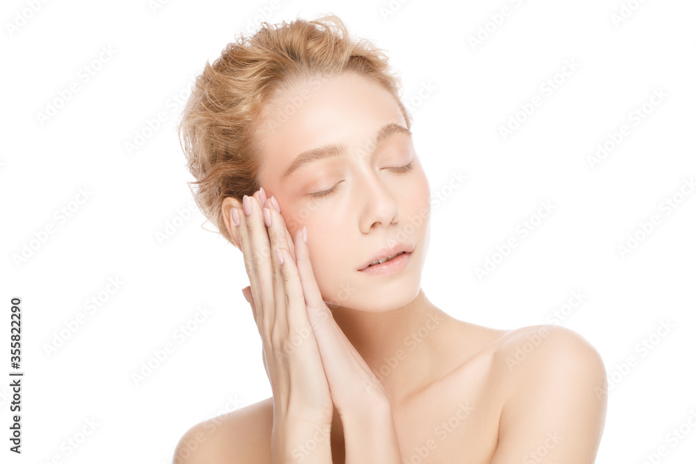 Beauty portrait of young beautiful blond woman face with closed eyes, touching her perfect skin with two hands, isolated on white background Beauty portrait of young beautiful blond woman face with closed eyes, touching her perfect skin with two hands, isolated on white background