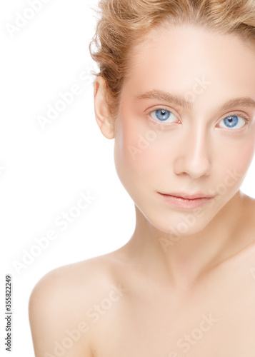 Vertical portrait of young beautiful blonde woman with blue eyes  concept of clean skin care and beauty  isolated on white