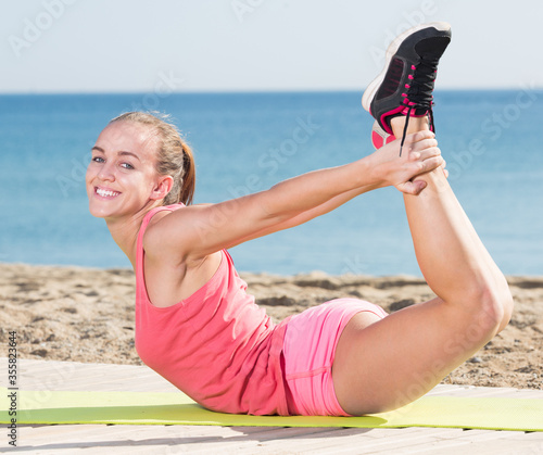 Positive sporty woman exercising
