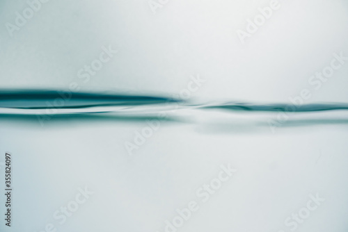 Background of pure water wave is swaying in the glass.