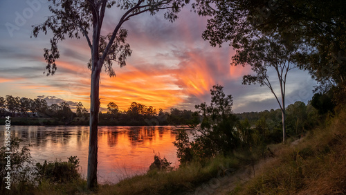 Fototapeta Naklejka Na Ścianę i Meble -  Panoramic River Sunset with Reflections
