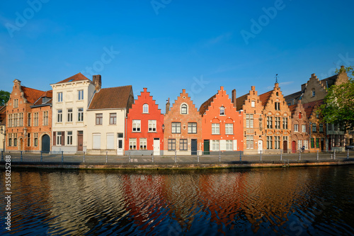 Typical Belgian cityscape Europe tourism concept - canal and old houses on sunset. Bruges (Brugge), Belgium © Dmitry Rukhlenko