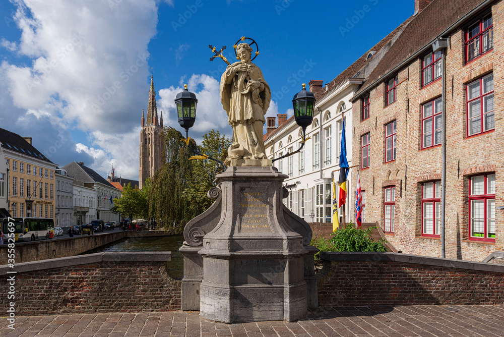 Statue of St.John of Nepomuk, on Wollestraat Bridge in Bruges, Belgium