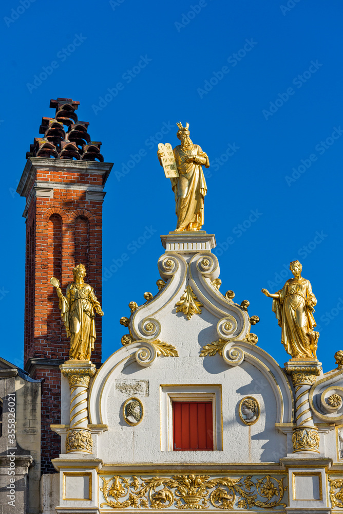 Fototapeta premium golden statue on City Hall of Bruges, Belgium