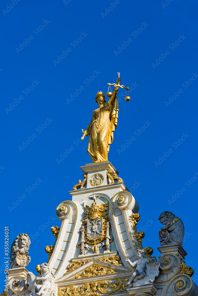 Fototapeta premium golden statue on City Hall of Bruges, Belgium