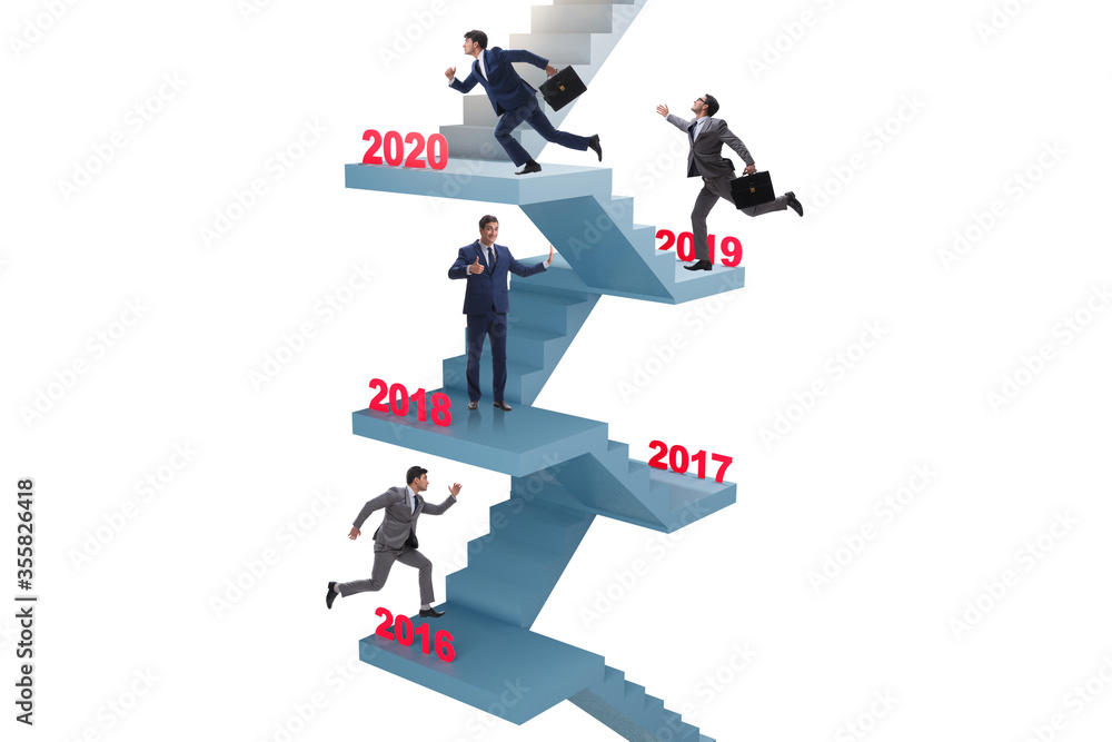 Businessman climbing stairs on yearly basis Businessman climbing stairs on yearly basis