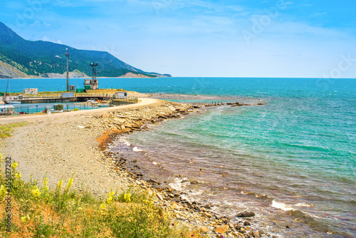 Black Sea coast, mountain and sea views. Towers and objects on the beach