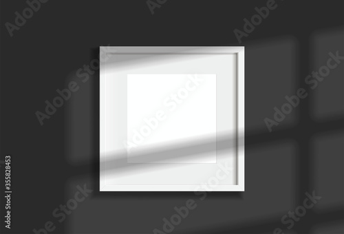 Minimal empty square white frame picture mock up hanging on dark wall background with window light and shadow. isolate vector illustration.