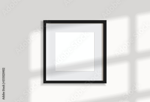 Minimal empty square black frame picture mock up hanging on white wall background with window light and shadow. isolate vector illustration.