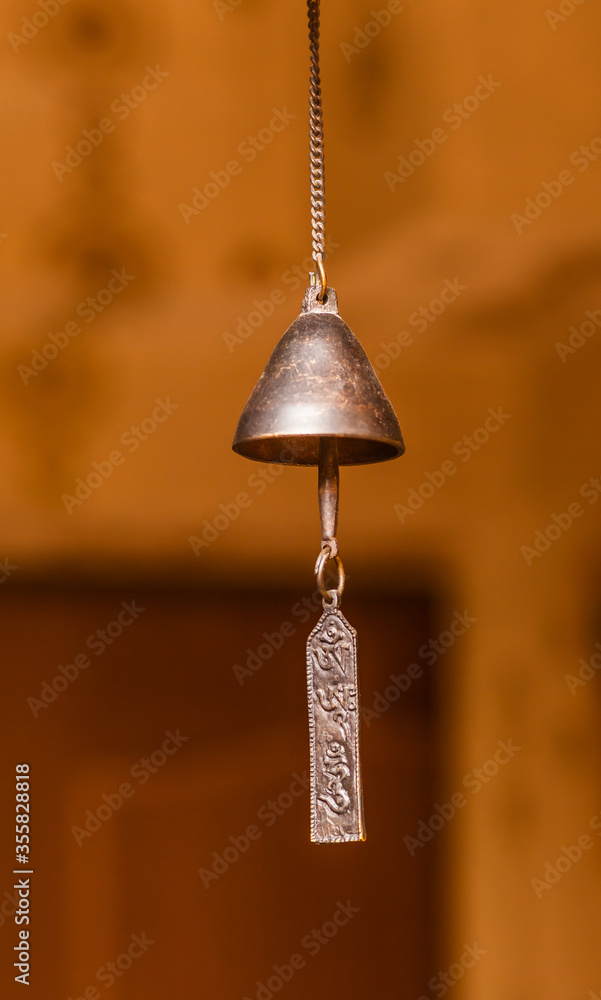Obraz premium Indian brass bell hanging on a chain