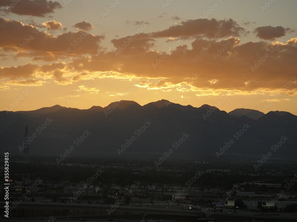 Amazing skies outline the silhouette of mountains as the sun sets over Las Vegas, Nevada