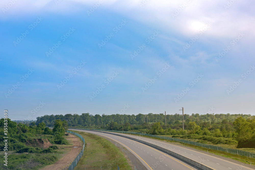 Road panorama on sunny spring day with lovely sky.