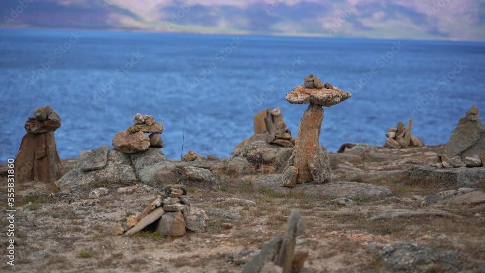 Sacred stone pyramides on the shore of Lkae Baikal on Olkhon island, Siberia, Russia Sacred stone pyramides on the shore of Lkae Baikal on Olkhon island, Siberia, Russia