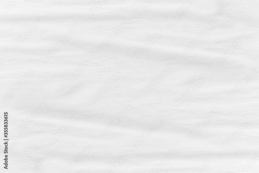 Close-up of white fabric texture background. Abstract crumpled cloth. Close-up of white fabric texture background. Abstract crumpled cloth.
