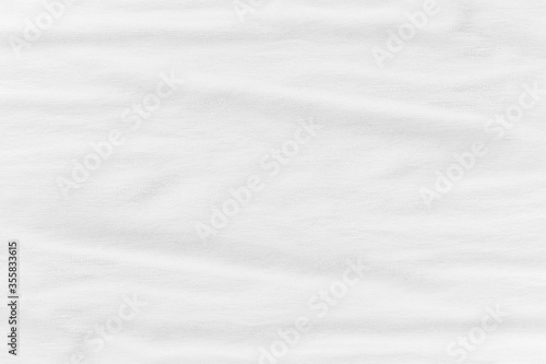 Close-up of white fabric texture background. Abstract crumpled cloth.