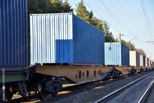 Cargo containers transportation on freight train by railway. Coronavirus Wreaks Havoc On Global Industry. Global economy is heading into a recession thanks to the widening fallout from the COVID-19