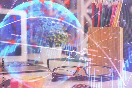 Wallpaper Mural Financial chart hologram with glasses on the table background. Concept of business. Double exposure. Torontodigital.ca