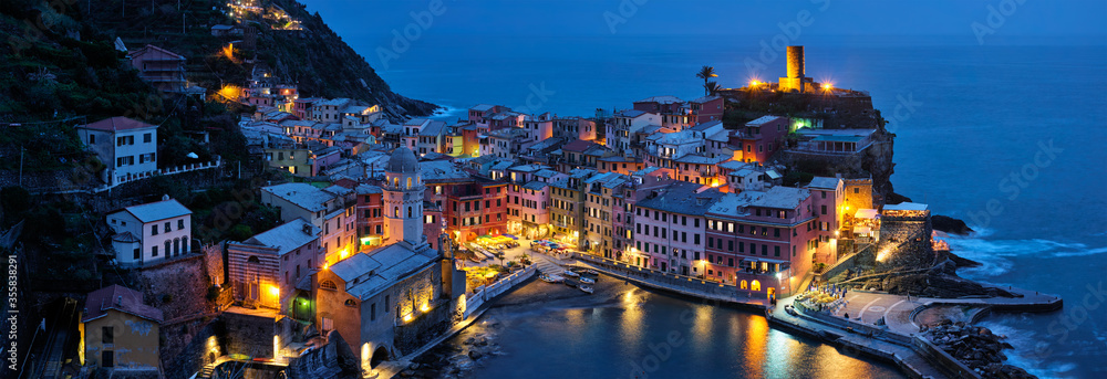 View of Vernazza village popular tourist destination in Cinque Terre National Park a UNESCO World Heritage Site, Liguria, Italy view illuminated in the night from Azure trail