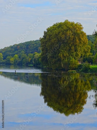 Europe  France  New Aquitaine  Charente  Village of Confolens  fisherman on the river La Vienne