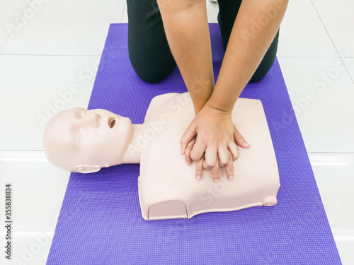 CPR first aid training with dummy. © Somphob