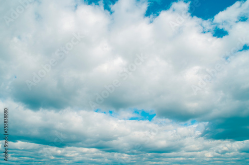 Background with blue sky with lots of white clouds