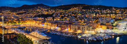 Panorama of Old Port of Nice with luxury yacht boats from Castle Hill, France, Villefranche-sur-Mer, Nice, Cote d'Azur, French Riviera in the evening blue hour twilight illuminated © Dmitry Rukhlenko
