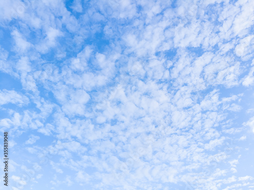 Fluffy white clouds in the bright blue sky