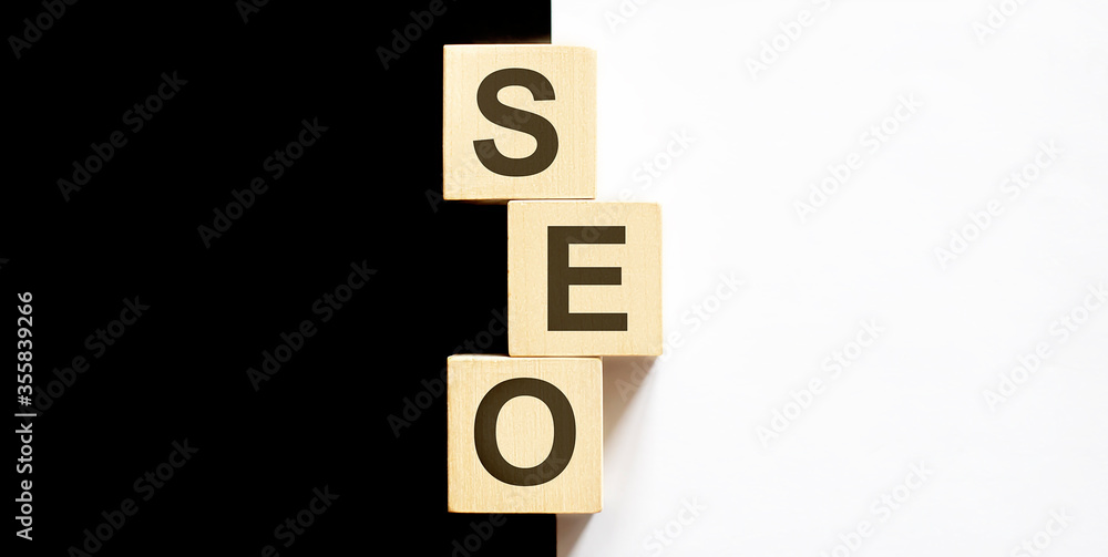 Business concept text SEO on wood block on the black and white background Business concept text SEO on wood block on the black and white background