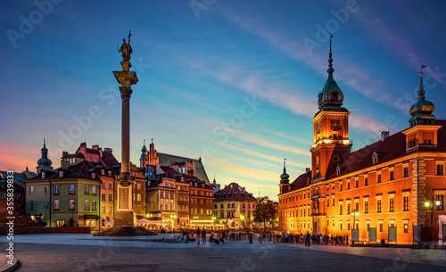 Evening view of the historic center of Warsaw. Panoramic view on Royal Castle, ancient townhouses and Sigismund's Column in Old town in Warsaw, Poland.