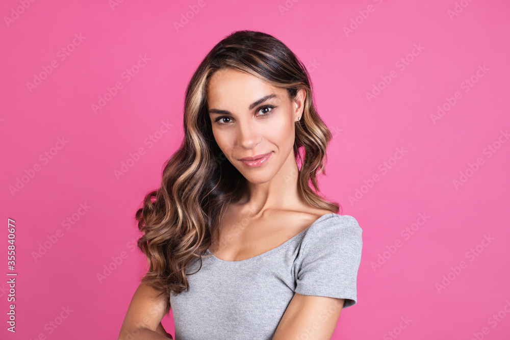 Portrait of a cheerful young girl looking at camera isolated over pink background. Portrait of a cheerful young girl looking at camera isolated over pink background.
