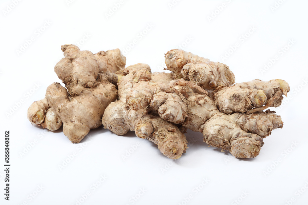 Fresh ginger root or rhizome isolated on white background
