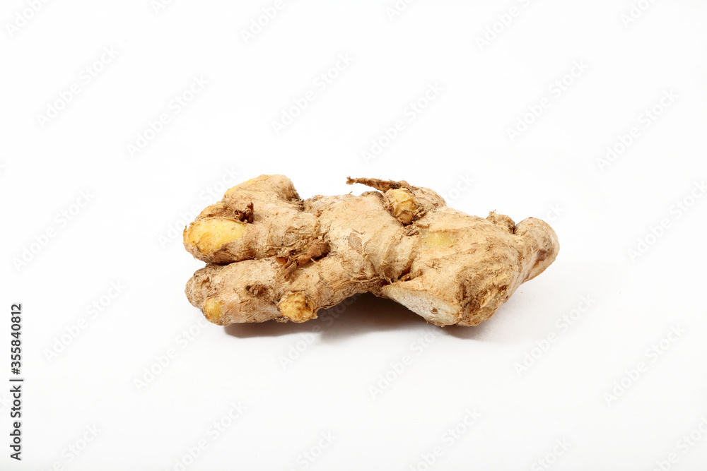 Fresh ginger root or rhizome isolated on white background