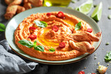 Fresh tomato hummus as red and healthy snack