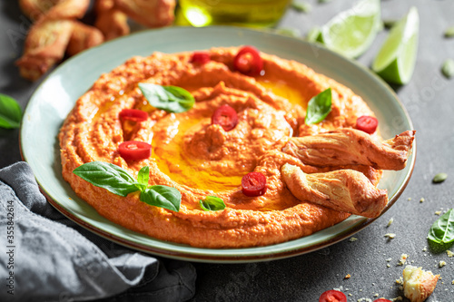 Fresh tomato hummus as red and healthy snack