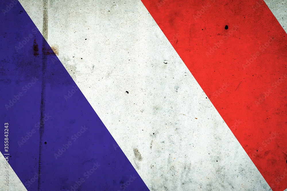 Fototapeta premium Flag of France on a concrete wall. Travels.