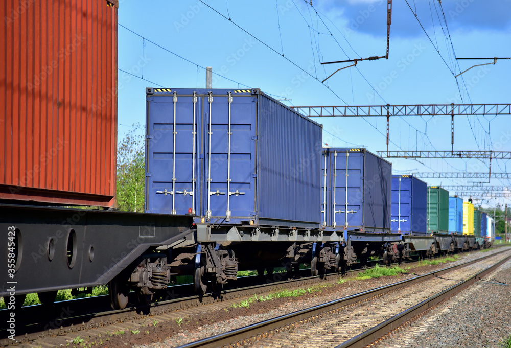 Cargo Containers Transportation On Freight Train By Railway. Intermodal Container On Train Car. Rail Freight Shipping Logistics Concept. Import - export goods from Сhina. Cargo Containers Transportation On Freight Train By Railway. Intermodal Container On Train Car. Rail Freight Shipping Logistics Concept. Import - export goods from Сhina.