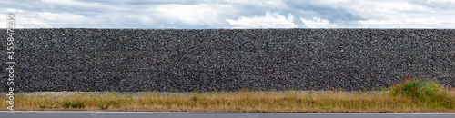 gabion wall made of metal grid filled with gravel