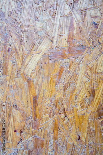 Obraz na płótnie Sheet of plywood with fragments of compressed sawdust. w salonie