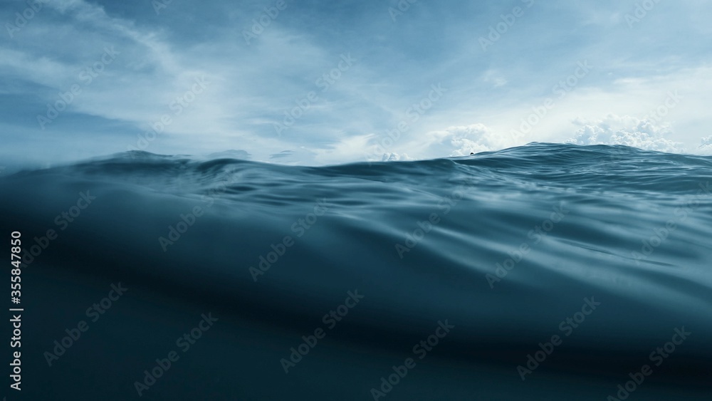 Wave on moving water surface close up in the middle of the screen.  Under Water Surface in the middle of the sea