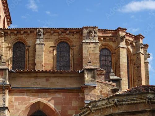 Gothic and Romanesque windows and brackets of the apse in the crerestory level. 12 and 13 Century. Cathedral of Sigüenza. Guadalajara. Spain. photo