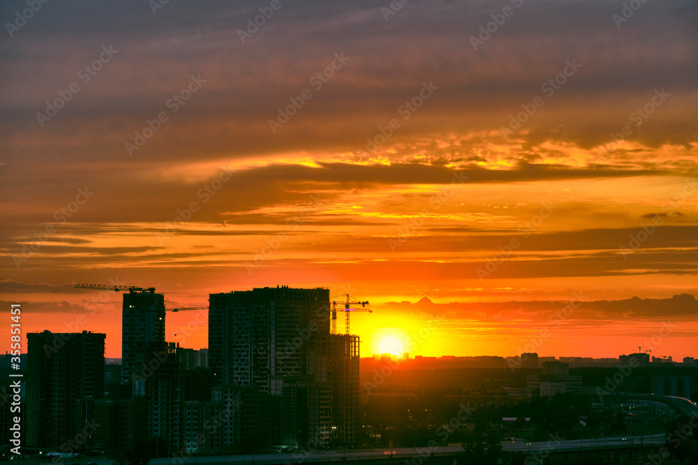 beautiful sunset over the silhouette of the east of Moscow color