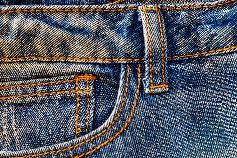 Blue Jeans Watch Pocket Design Details without Rivets and Seams CloseUp Blue Jeans Watch Pocket Design Details without Rivets and Seams CloseUp