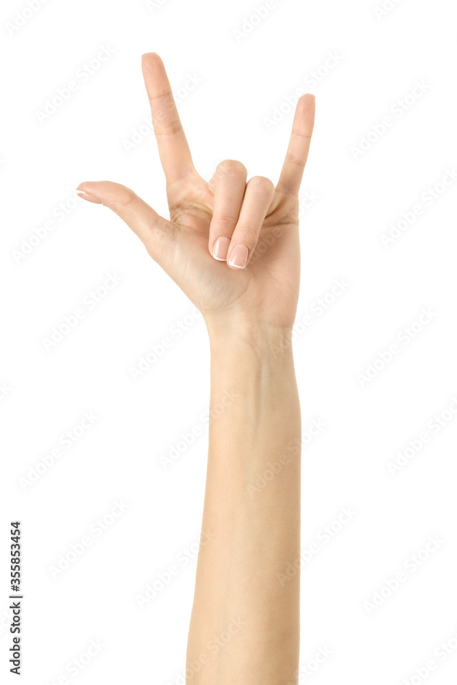 Rock and roll! Woman hand gesturing isolated on white Rock and roll! Woman hand gesturing isolated on white