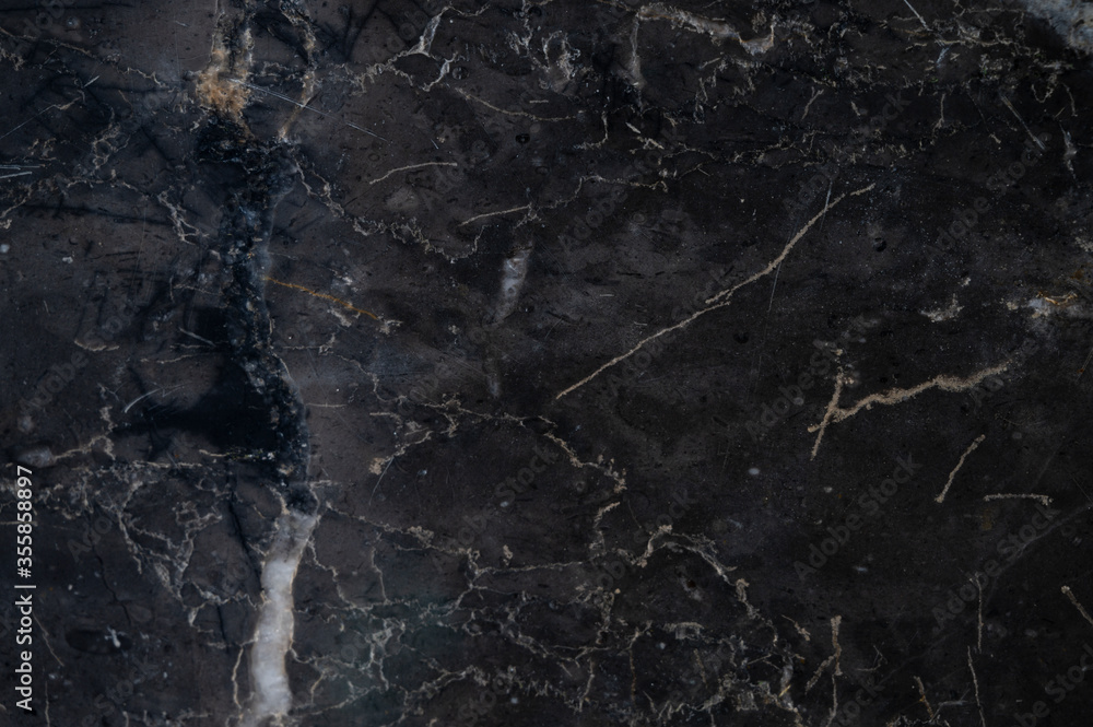 background texture of black marble tiles.
