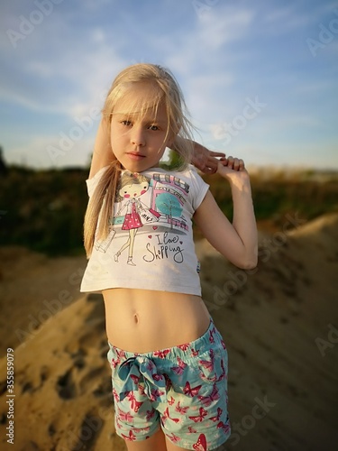 Blonde girl on the sand