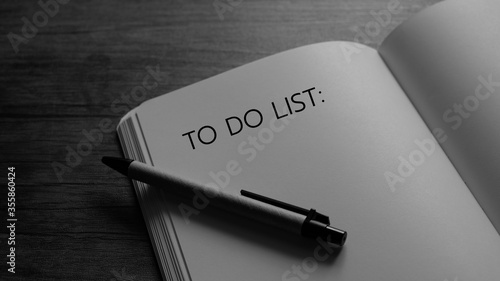 B/W To do list writing on notebook - Business concept. photo