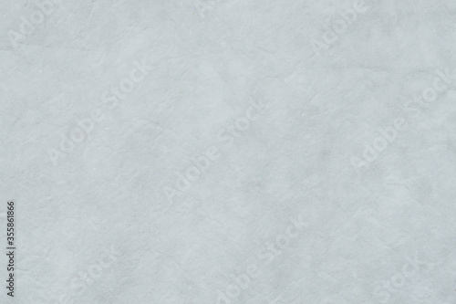 Paper white background from Japanese hand made pastel craft grey white mulberry flower rough textured. Recycled plain clean eco friendly kraft handmade gray natural material for Christmas decoration.